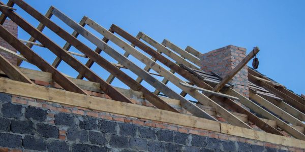 House under construction. Roofing tiles preparing to Install